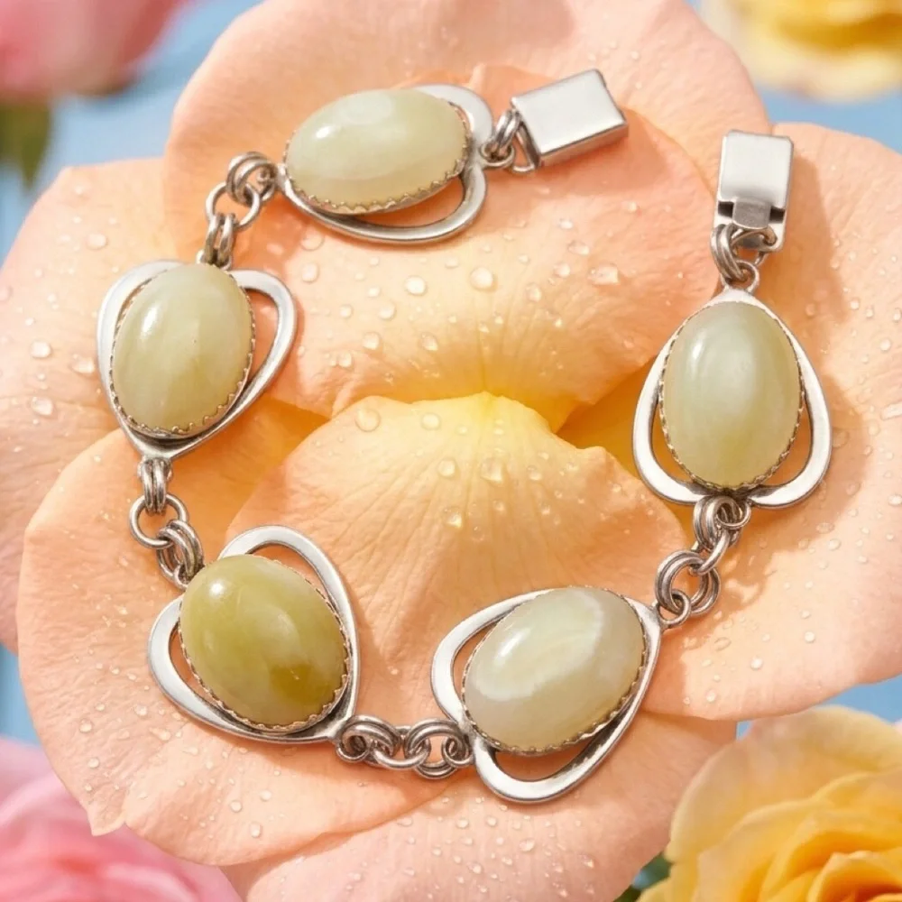Rhodium Plated Bracelet with Pale Green Amber Cabochons